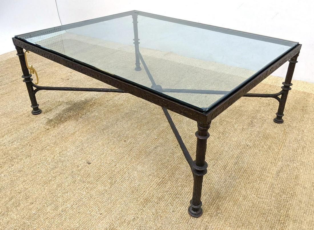 Giacometti Style Bronze and Glass Cocktail Table. Styli: Giacometti Style Bronze and Glass Cocktail Table. Stylized Coffee Table Base with Gilt metal hanging monkey accent.-- Dimensions: H: 19 inches: W: 48 inches: D: 36 inches ---