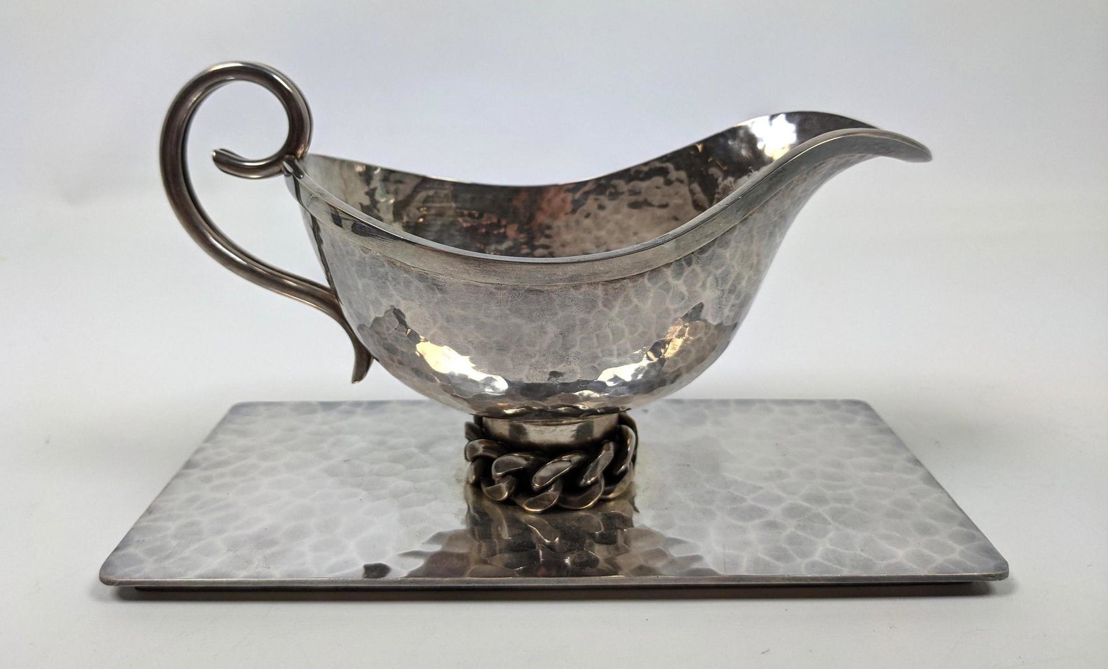 JEAN DESPRES Silver Plate Gravy Boat. Hammered Texture: JEAN DESPRES Silver Plate Gravy Boat. Hammered Texture on elegant form on "Chain link" foot. French Modern Design. Engraved signature.-- Dimensions: H: 4.5 inches: W: 8 inches: D: 4 inches ---