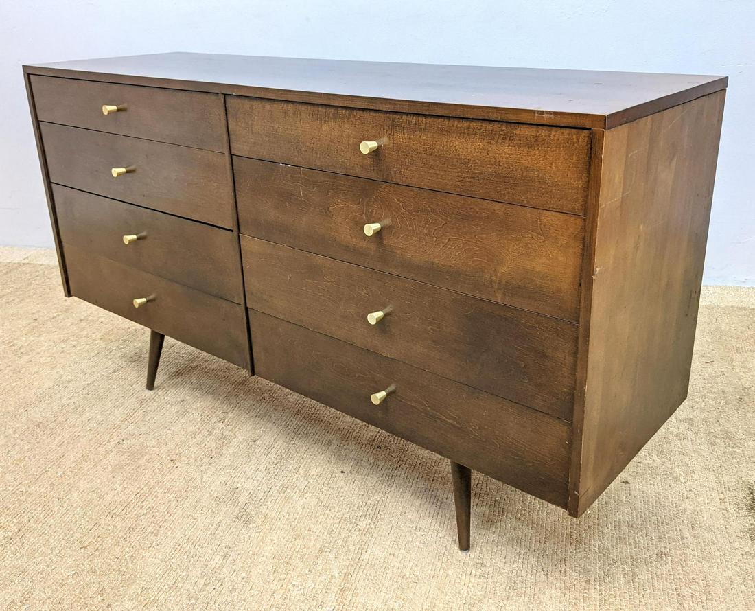PAUL McCOBB American Walnut Dresser Credenza. Modern 8: PAUL McCOBB American Walnut Dresser Credenza. Modern 8 drawer cabinet raised on legs. Iconic metal pulls. Marked McCobb Planner Group-- Dimensions: H: 33 inches: W: 60 inches: D: 19 inches ---