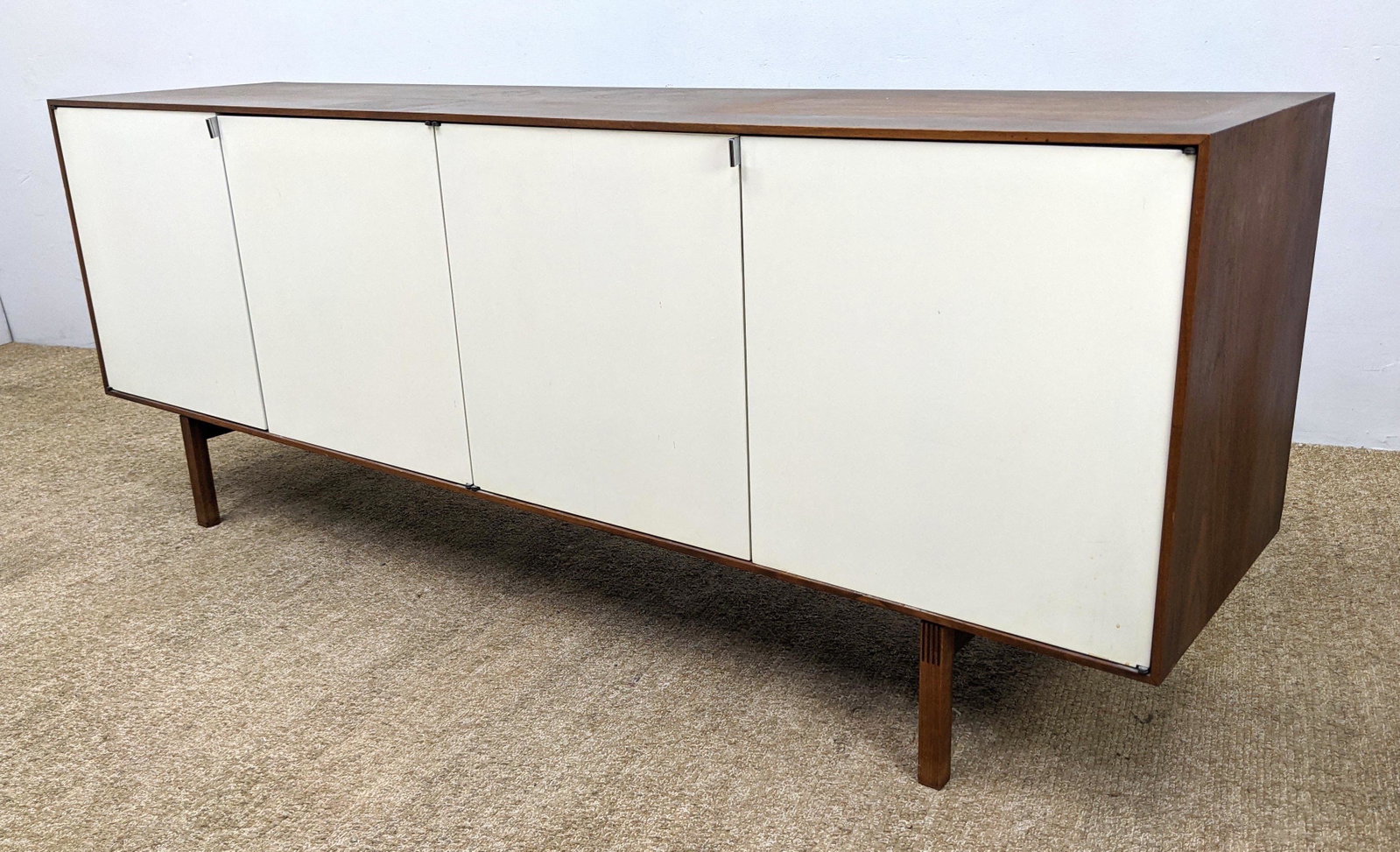 KNOLL American Modern Walnut Credenza with White Doors.: KNOLL American Modern Walnut Credenza with White Doors. Raised on Legs. -- Dimensions: H: 28.5 inches: W: 75.5 inches: D: 18.5 inches ---