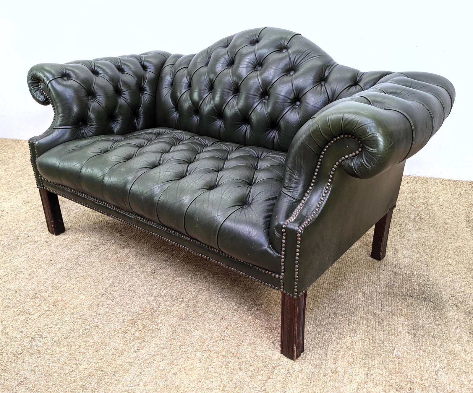 Tufted Green Leather Sofa Loveseat. Arched back with r: Tufted Green Leather Sofa Loveseat. Arched back with rolled arms. -- Dimensions: H: 33 inches: W: 62 inches: D: 35 inches ---