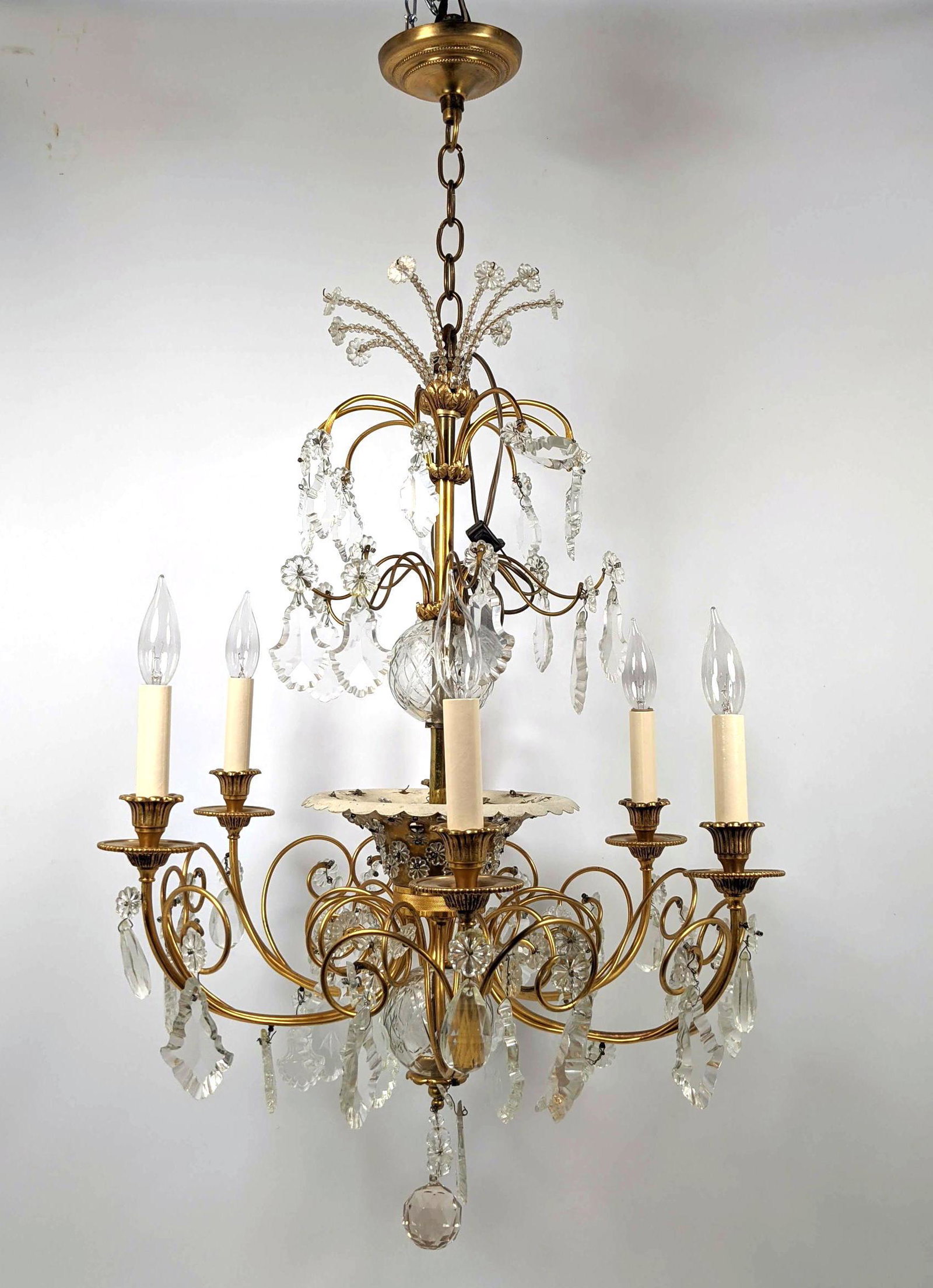 Fancy Ornate Chandelier. Pendant Prisms. Floral Rosette: Fancy Ornate Chandelier. Pendant Prisms. Floral Rosettes. Six arms with candle form lights-- Dimensions: H: 38 inches: W: 22 inches: D: 22 inches ---