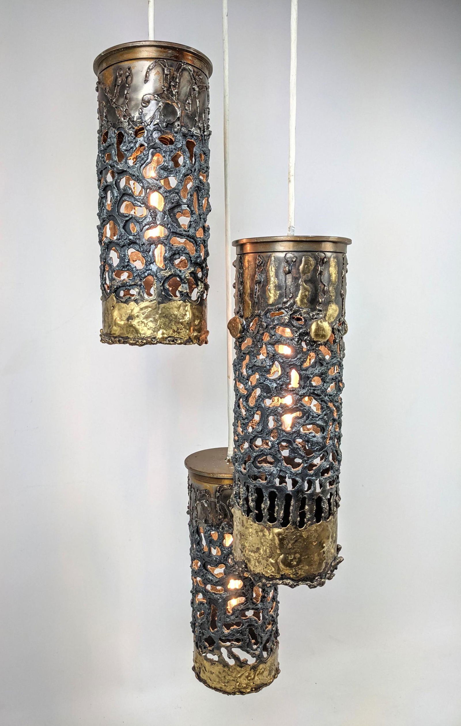 Heavy Brutalist 3 Shade Chandelier Pendant Lamp. Shades: Heavy Brutalist 3 Shade Chandelier Pendant Lamp. Shades made from Mortar Shells. -- Dimensions: H: 43 inches: W: 10 inches: D: 10 inches ---