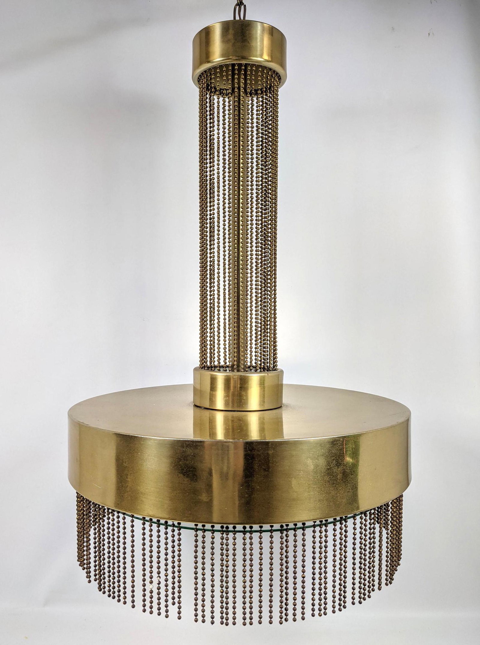 PIERRE CARDIN for LAUREL Hanging Light Chandelier. Fren: PIERRE CARDIN for LAUREL Hanging Light Chandelier. French Lighting Design. Brass body with rows of dangling ball chain. Modernist Lighting. Signed. Laurel paper label. -- Dimensions: H: 30 inches: W: 