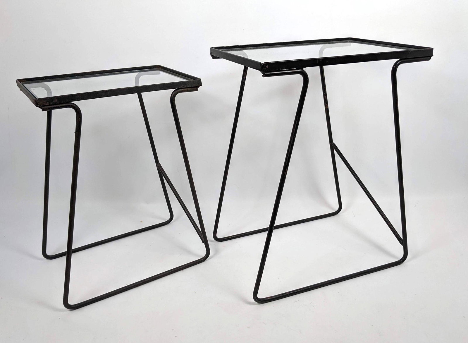 2pc Nesting Iron and Glass Patio Side Tables. Some Rust: 2pc Nesting Iron and Glass Patio Side Tables. Some Rust.-- Dimensions: H: 19.5 inches: W: 14.5 inches: D: 10.5 inches ---