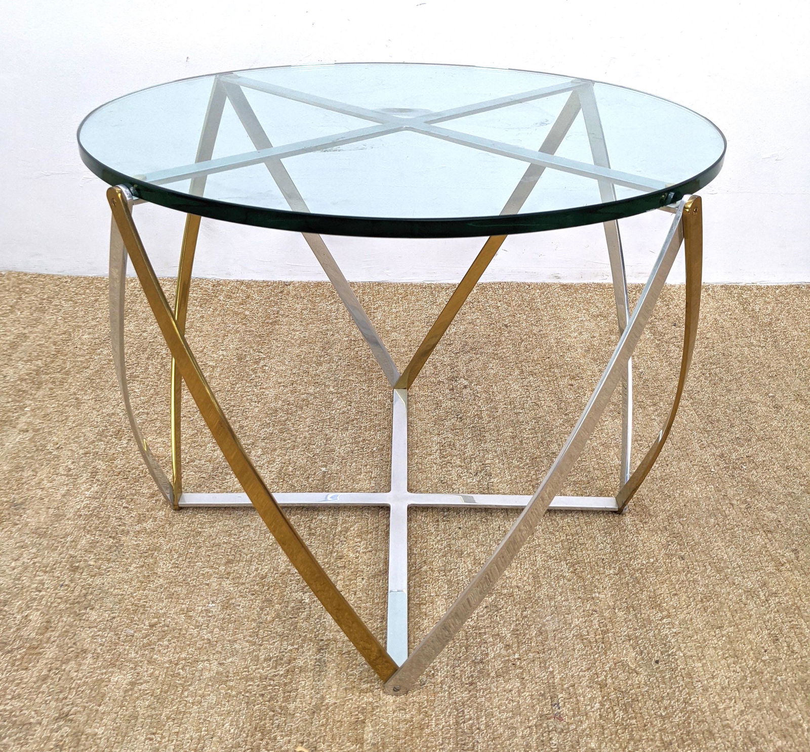 JOHN VESEY Occasional Side Table. Two Tone Metal Base: JOHN VESEY Occasional Side Table. Two Tone Metal Base Glass Top Side End Table. Architectural brass and chrome band base. Thick round glass top. Unmarked.-- Dimensions: H: 24 inches: W: 30 inches: D: