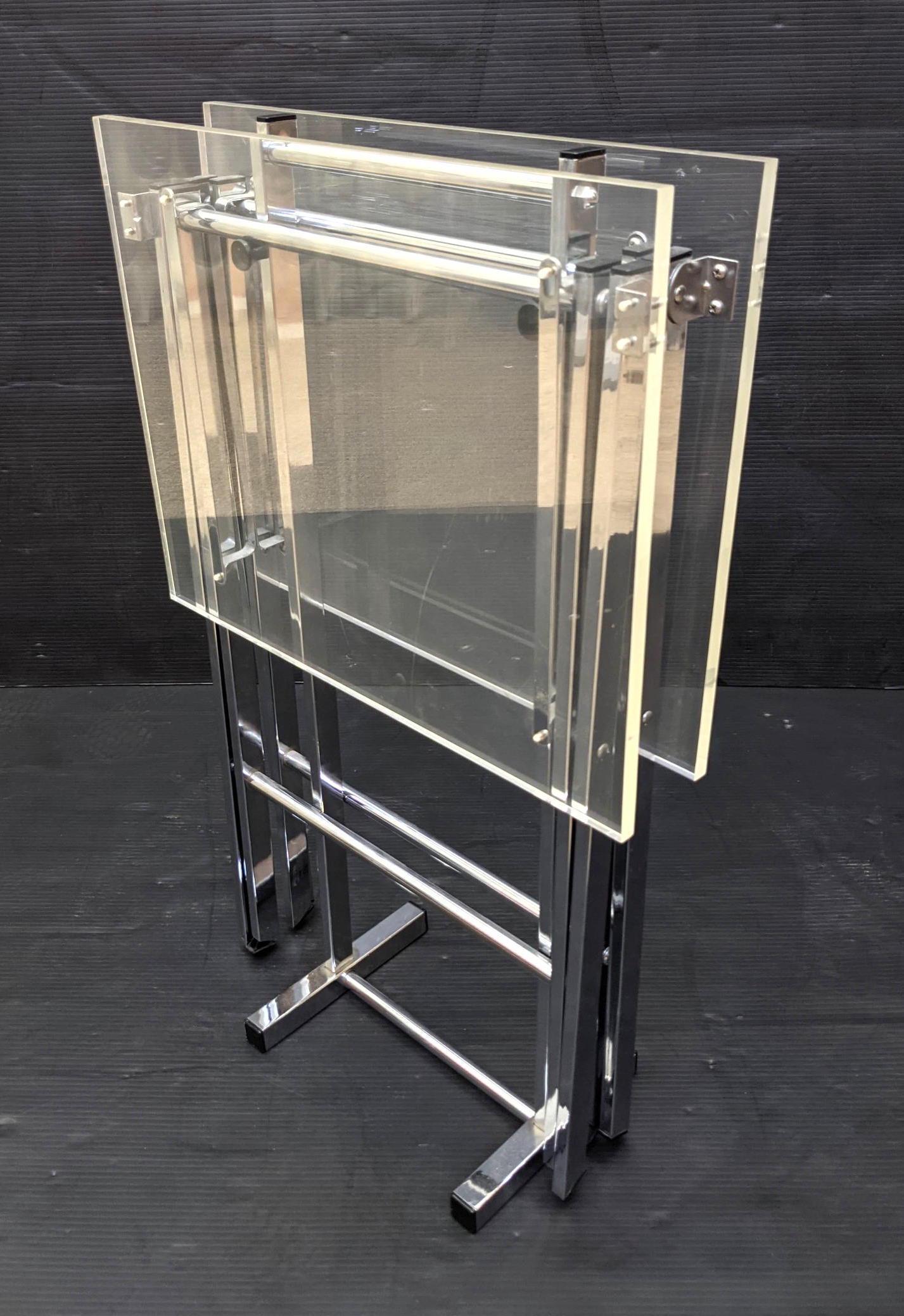Stand with Two Lucite Chrome Folding TV Tables. Modern: Stand with Two Lucite Chrome Folding TV Tables. Modern Serving.-- Dimensions: H: 30 inches: W: 19 inches: D: 8 inches ---
