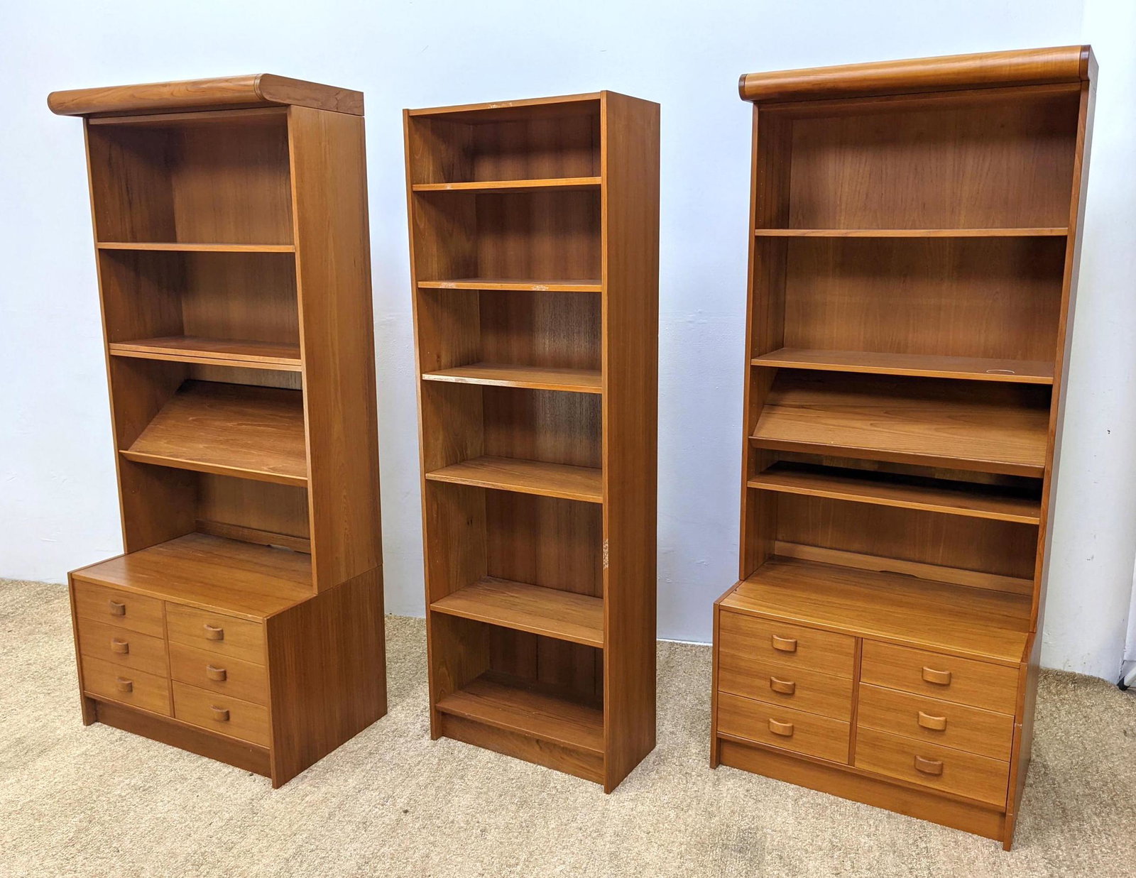 3pc DOMINO MOBLER Danish Modern Teak Wall Units. Two ha: 3pc DOMINO MOBLER Danish Modern Teak Wall Units. Two have Bookcase Tops with Storage Below. One is narrow bookcase display shelf unit. Made in Denmark label. -- Dimensions: H: 74.5 inches: W: 31.5 inc