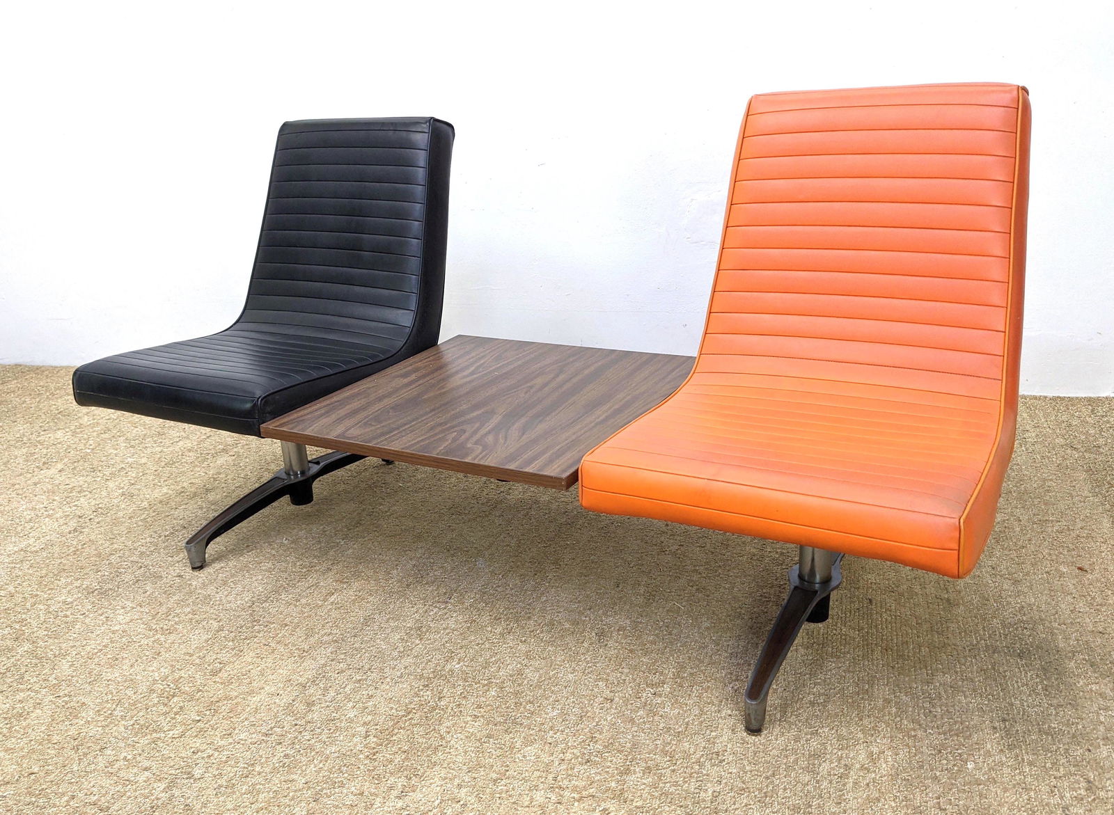 CHROMCRAFT Modernist Two Seater Lounge Chairs. Orange a: CHROMCRAFT Modernist Two Seater Lounge Chairs. Orange and Black Vinyl Chairs with Center Table. Marked. -- Dimensions: H: 32 inches: W: 64 inches: D: 24 inches ---