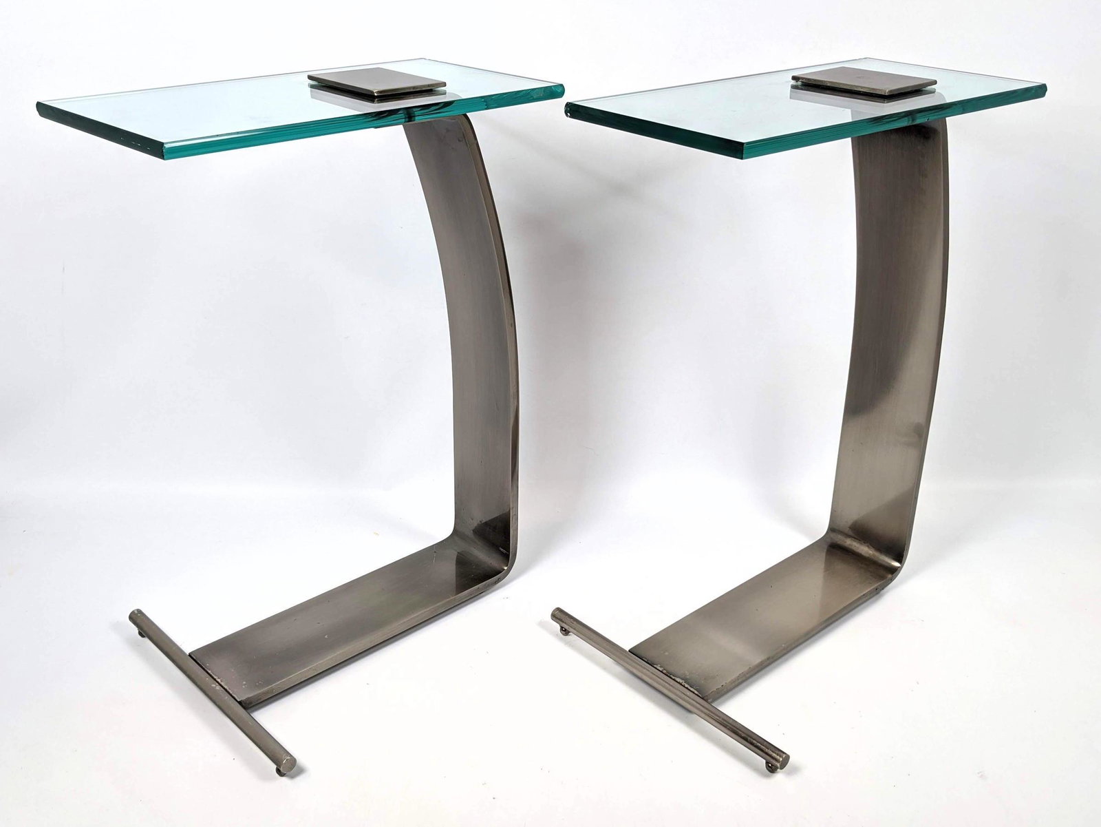 Pair DIA Design Institute of America Glass Side Table.: Pair DIA Design Institute of America Glass Side Table. Steel and glass. Slight difference in color. Signed -- Dimensions: H: 22.25 inches: W: 12 inches: D: 16 inches ---