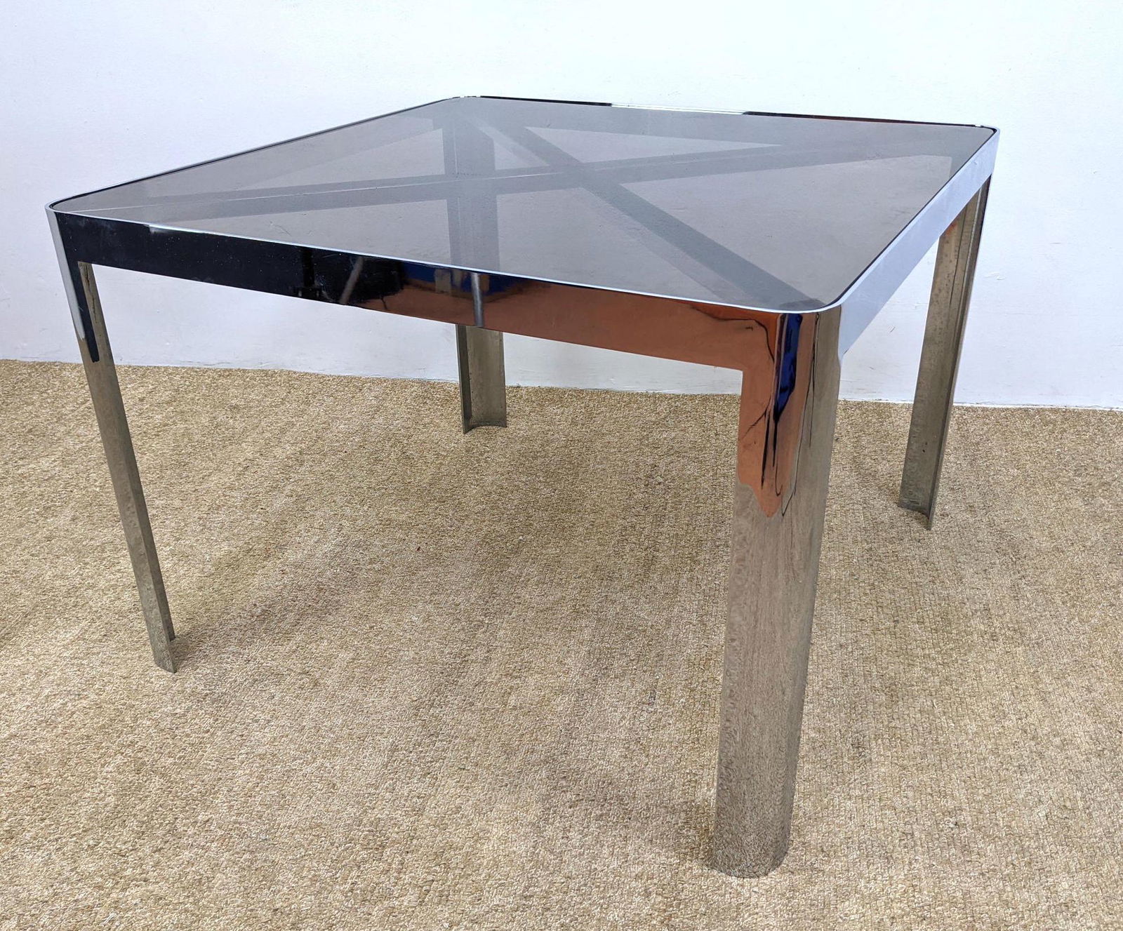 Square Dining Table Attributed to BRUETON. Chrome Glass: Square Dining Table Attributed to BRUETON. Chrome Glass Rounded Square Dining Table. Modernist. "X" Stretcher supports glass-- Dimensions: H: 29 inches: W: 42 inches: D: 42 inches ---