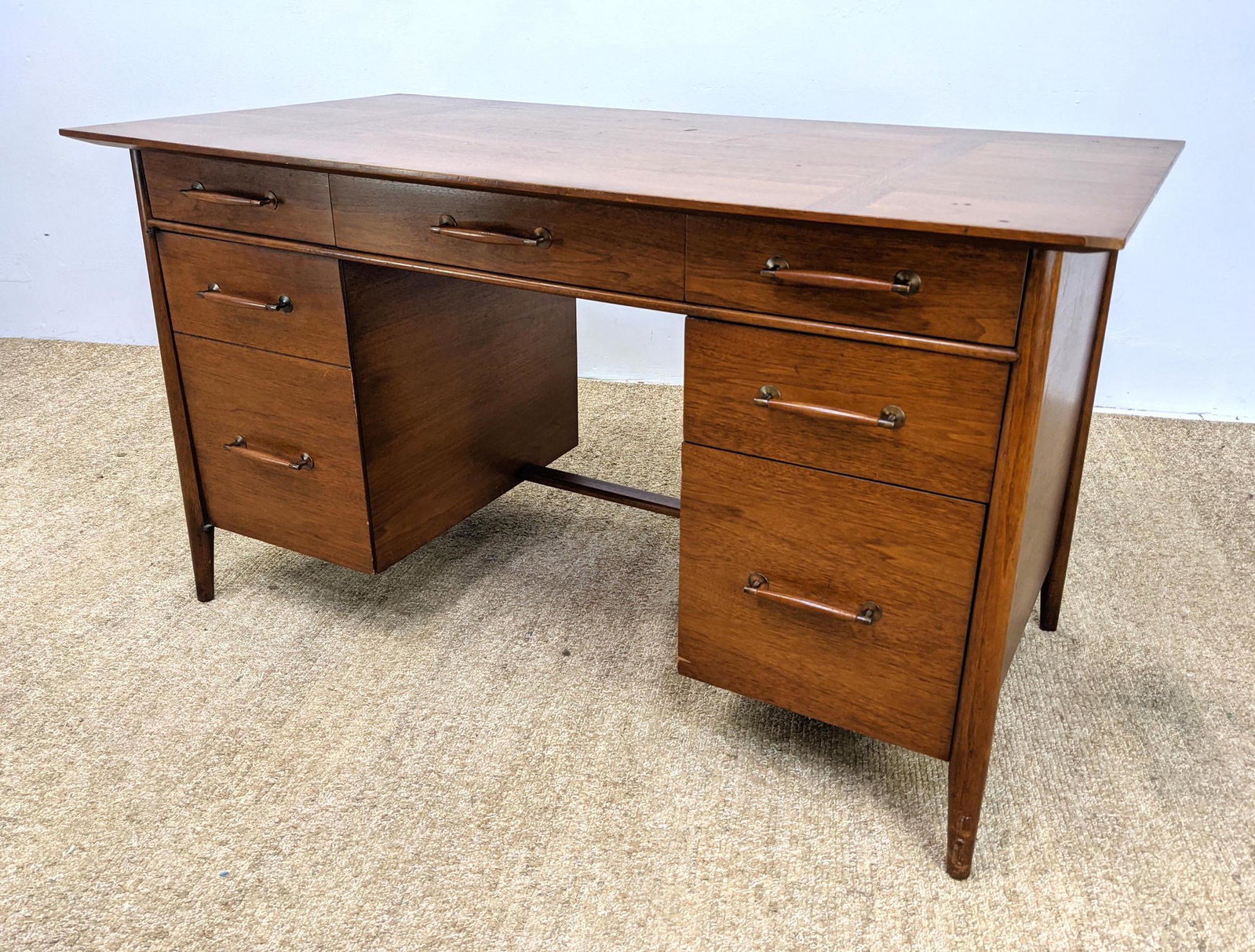 HENREDON American Modern Desk. Wood Pulls with metal ca: HENREDON American Modern Desk. Wood Pulls with metal caps. Raised on legs. Marked. -- Dimensions: H: 30 inches: W: 54 inches: D: 28 inches ---
