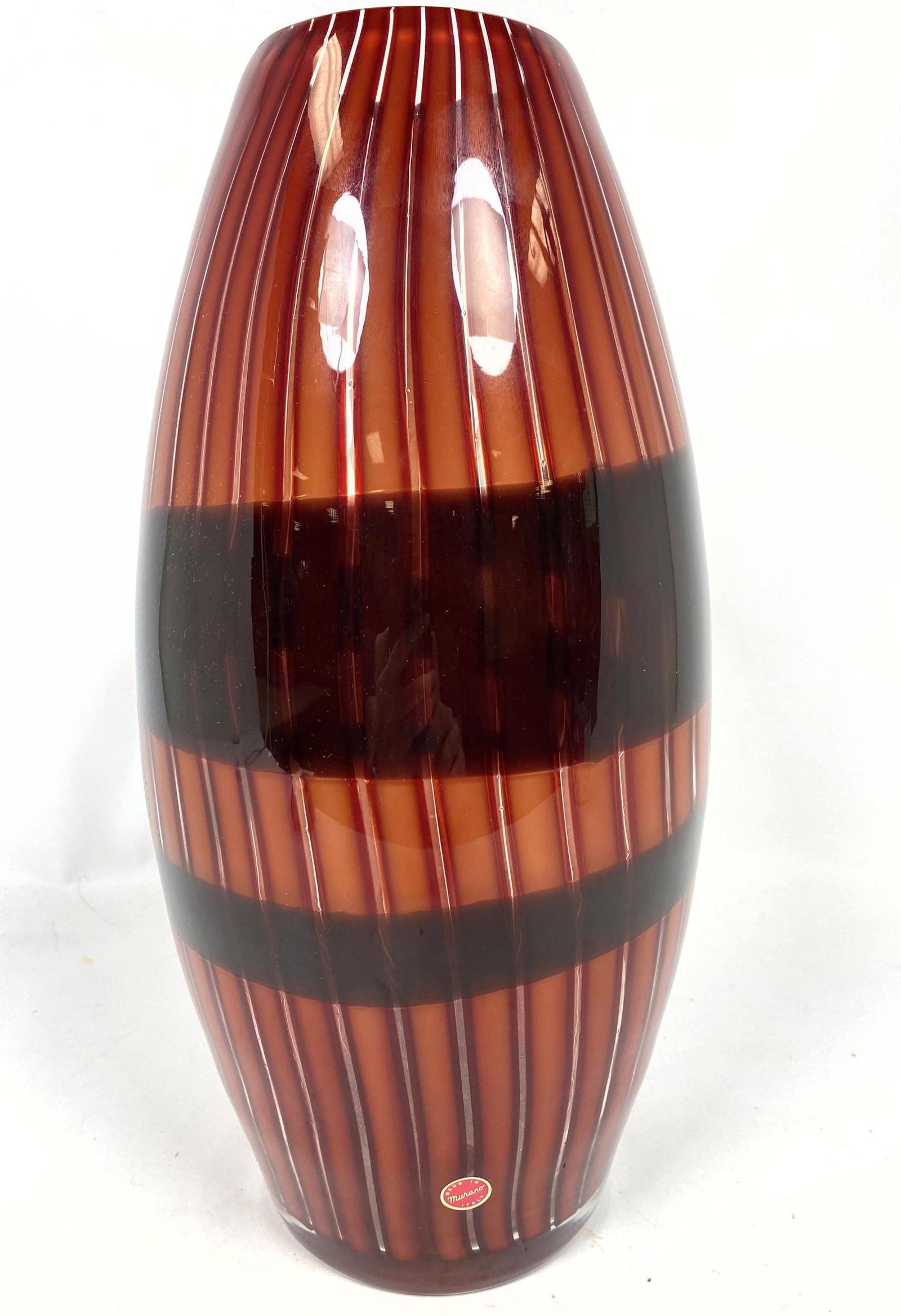 Murano Italian Art Glass Vase. Vertical interior design: Murano Italian Art Glass Vase. Vertical interior design with dark colored bands. Foil label.-- Dimensions: H: 16 inches: W: 7 inches: D: 7 inches ---