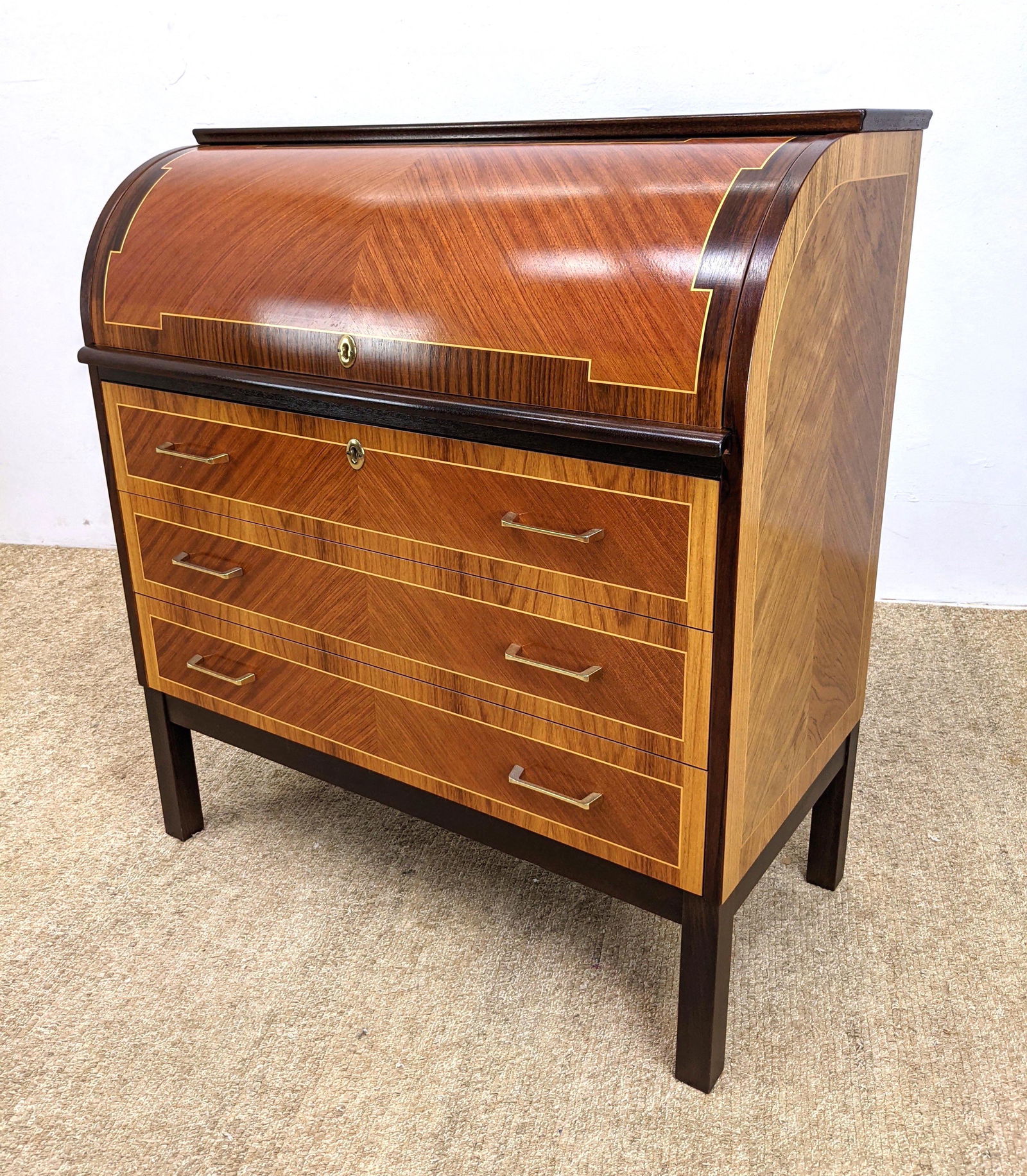Bubinga and Rosewood Roll Top Desk. SCANDINAVIAN GALLER: Bubinga and Rosewood Roll Top Desk. SCANDINAVIAN GALLERY by GUSTAFSSON. Pencil inlay trim. Fitted interior with floral inlay drawers. Marked-- Dimensions: H: 39 inches: W: 35.5 inches: D: 19 inches --