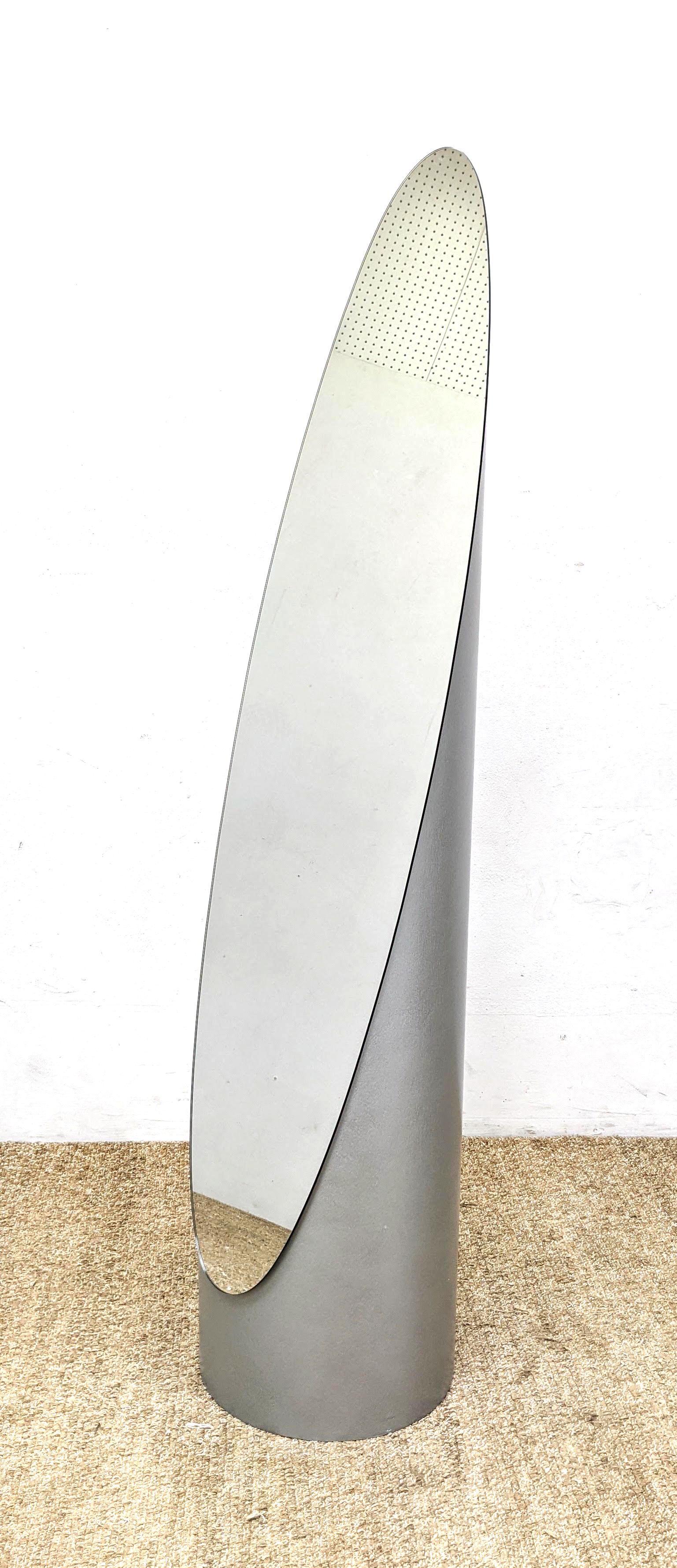 GAO Contemporary Home Lipstick Form Floor Mirror. Metal: GAO Contemporary Home Lipstick Form Floor Mirror. Metallic Silver Case. Unmarked.-- Dimensions: H: 56 inches: W: 12.5 inches: D: 12.5 inches ---