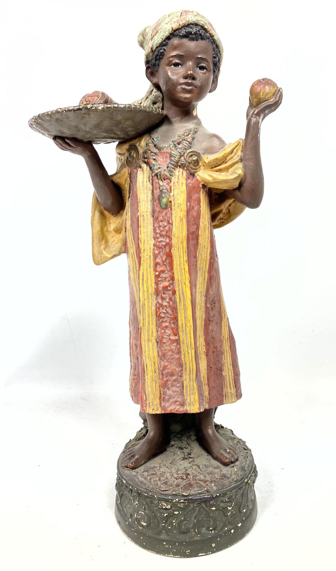 Antique Terra-cotta Figure Sculpture of boy fruit selle: Antique Terra-cotta Figure Sculpture of boy fruit seller.-- Dimensions: H: 17 inches: W: 8 inches: D: 5 inches ---
