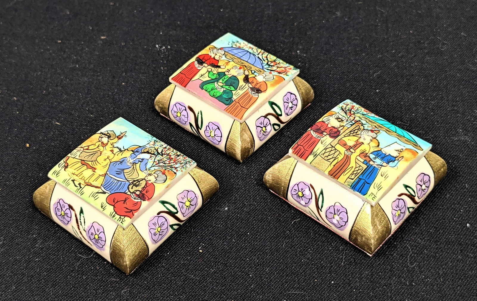 Lot three decorative boxes. Lids with painted scenes.: Lot three decorative boxes. Lids with painted scenes. -- Dimensions: H: 1 inches: W: 1.5 inches: D: 1.5 inches ---