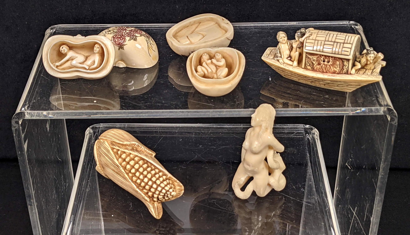 Collection of 5 Naughty Carved Asian Figures. All with: Collection of 5 Naughty Carved Asian Figures. All with carved erotic themes. Three lidded boxes with interior carving. One boat form netsuke. One carved nude. Three are signed. -- Dimensions: H: 2.5 i