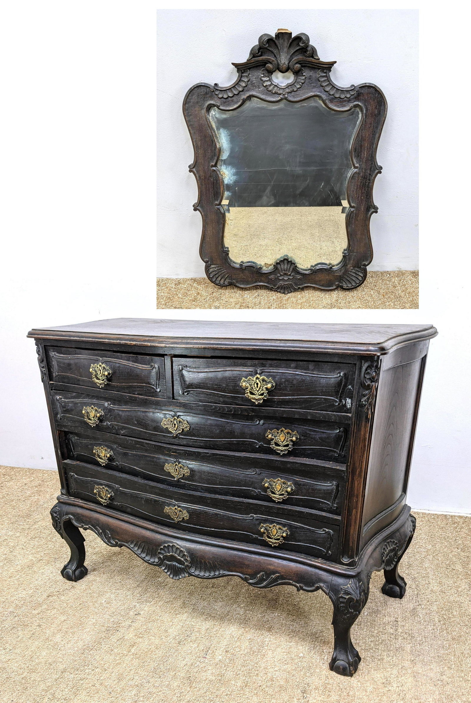 Antique Dresser Chest with mirror. Carved Wood Trim. Ba: Antique Dresser Chest with mirror. Carved Wood Trim. Ball and Claw Feet. Brass pulls-- Dimensions: H: 35 inches: W: 45 inches: D: 20 inches ---