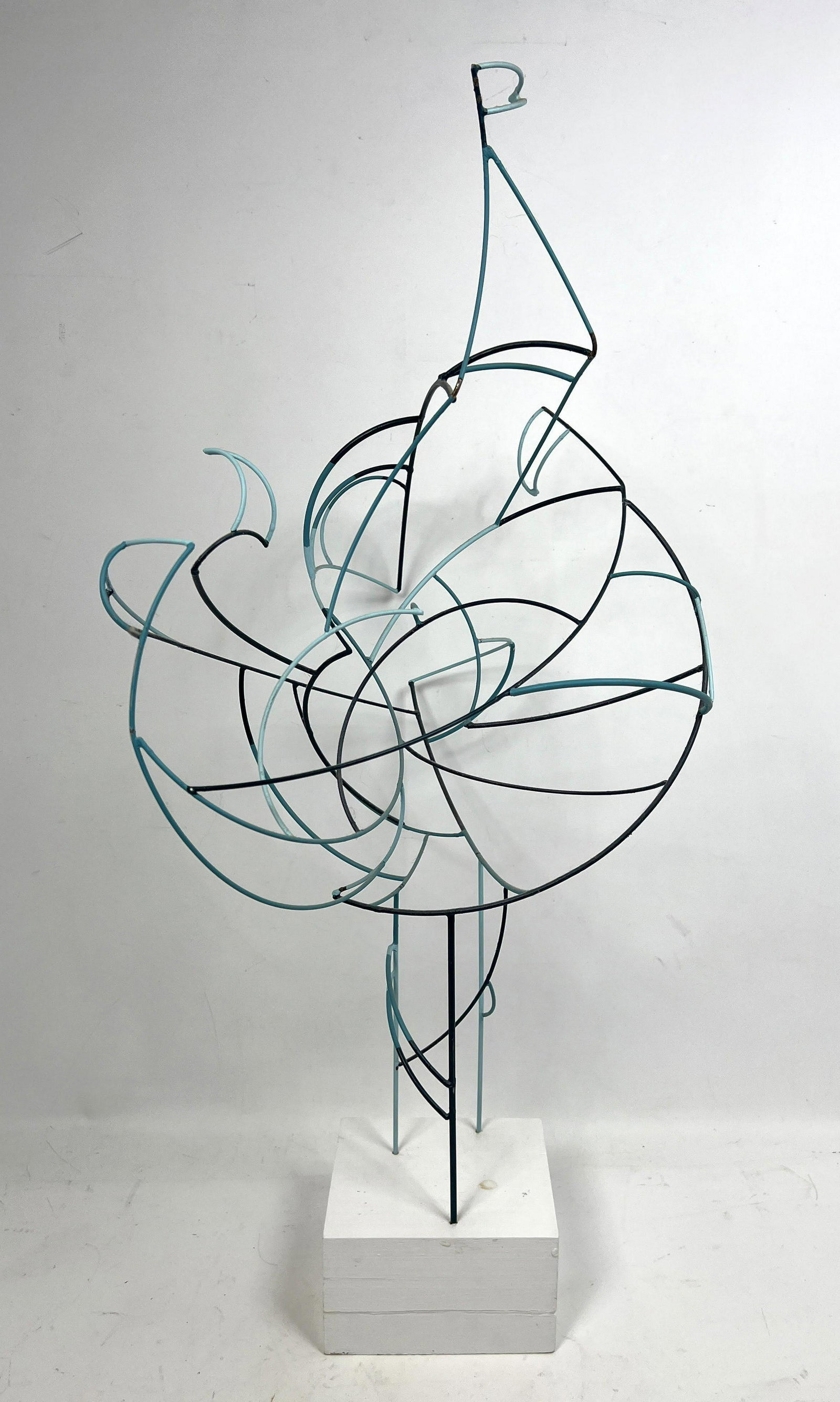 Modernist Abstract Metal Rod Sculpture. Sail like forms: Modernist Abstract Metal Rod Sculpture. Sail like forms in painted shades of blue and turquoise. White block base.-- Dimensions: H: 31 inches: W: 16 inches: D: 16 inches ---