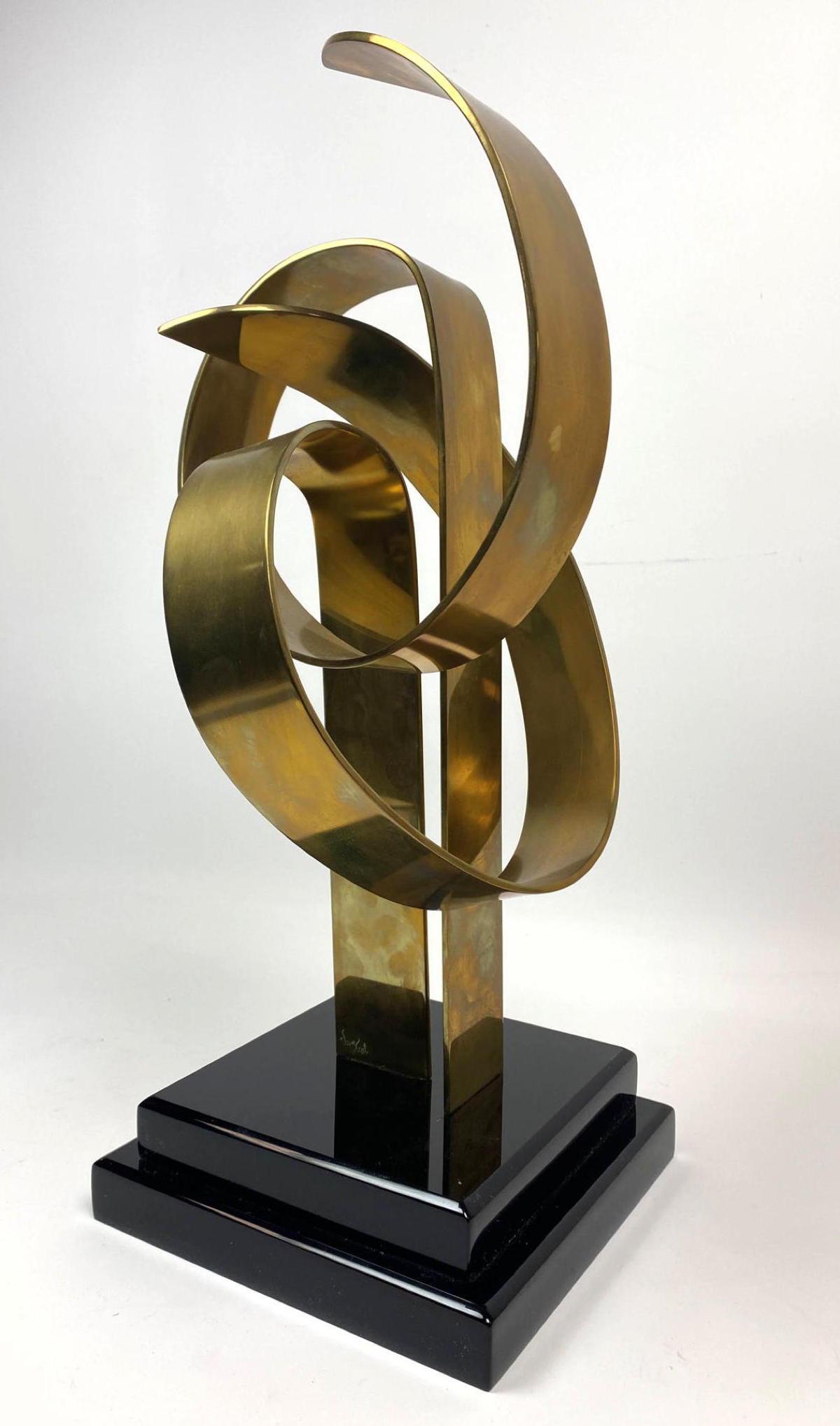 VAN TEAL Brass Table Sculpture. Acrylic base. Ribbon Fo: VAN TEAL Brass Table Sculpture. Acrylic base. Ribbon Form.-- Dimensions: H: 17.5 inches: W: 7.5 inches: D: 7.5 inches ---