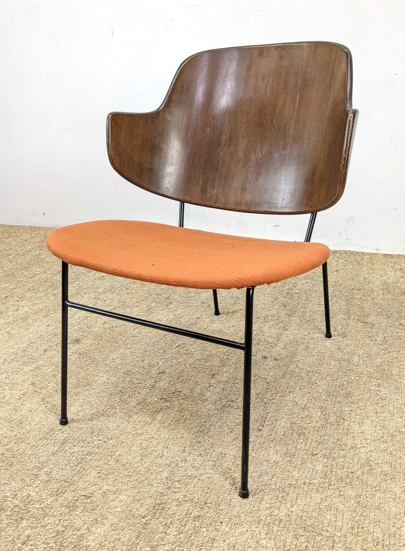 IB KOFOD LARSEN "Penguin" Lounge Chair. Danish Modern s: IB KOFOD LARSEN "Penguin" Lounge Chair. Danish Modern seating; Black iron legs with bowed wood backrest. SELIG. -- Dimensions: H: 29 inches: W: 21 inches: D: 23 inches ---