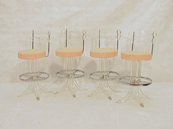 Four Modernist Lucite and Chrome Bar Stools.: Four Modernist Lucite and Chrome Bar Stools. Dimensions: H: 35 inches: W: 17 inches Condition (General): Some pitting to chrome.Please contact us with specific questions about condition, not visible i