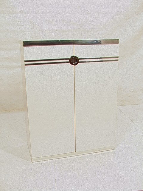 PIERRE CARDIN 2 Door Gentleman's Chest Wardrobe.: PIERRE CARDIN 2 Door Gentleman's Chest Wardrobe. White Lacquer with Chrome Accents. Marked. Dimensions: H: 15.75 inches: W: 38 inches: D: 19 inches Condition (General): Some loss to bottom left corner