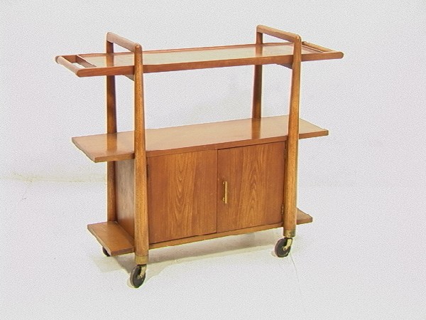 American Modern ROBSJOHN GIBBINGS inspired Rollin: American Modern ROBSJOHN GIBBINGS inspired Rolling Tea Cart Bar Server. Two tiers over two door cabinet. Dimensions: H: 34.5 inches: W: 42 inches: D: 14 inches Condition (General): Very Good Condition