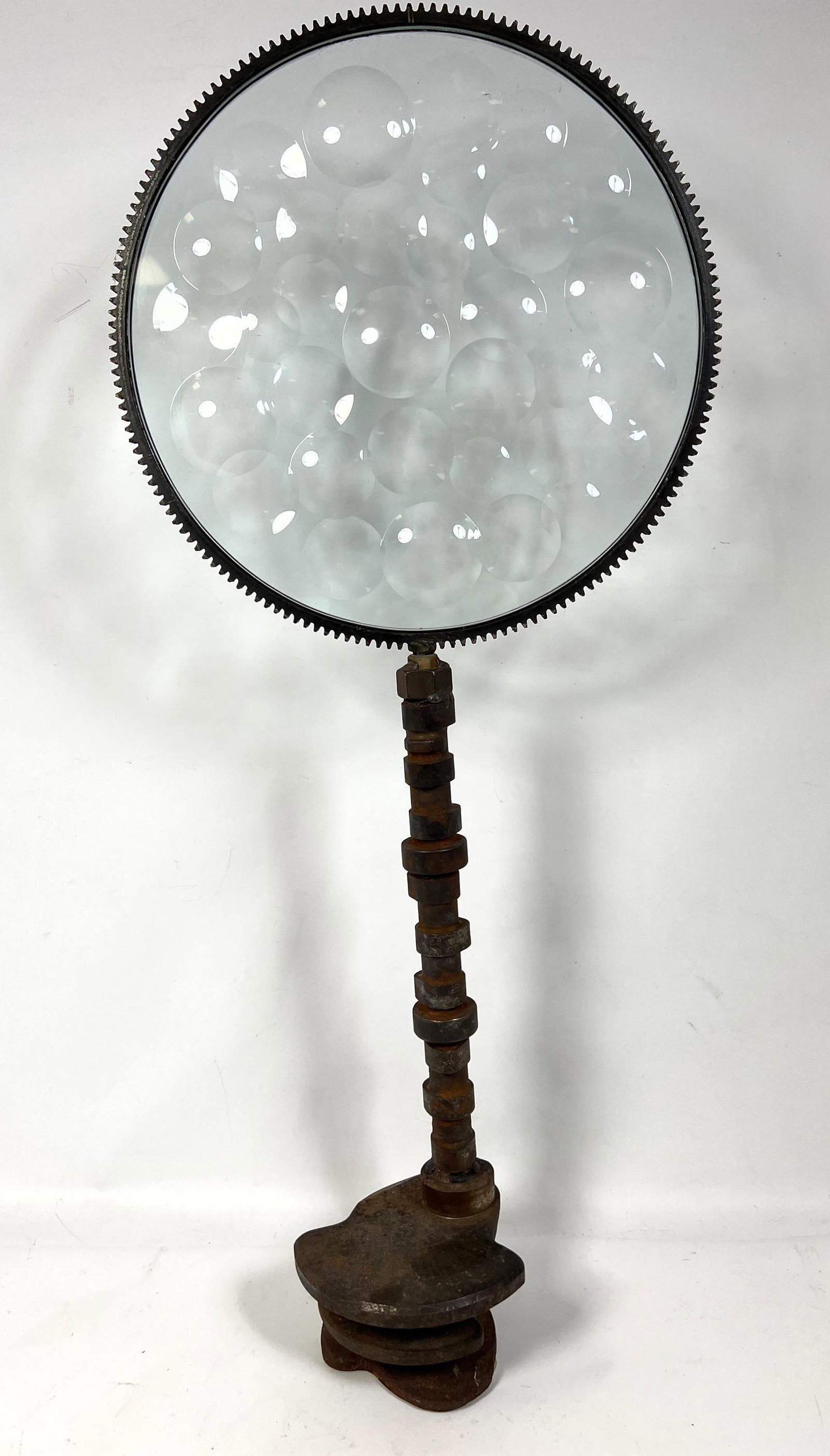 Industrial Magiscope Round Dimpled Glass Panel. Framed: Industrial Magiscope Round Dimpled Glass Panel. Framed above cam shaft base. -- Dimensions: H: 32 inches: W: 14 inches ---