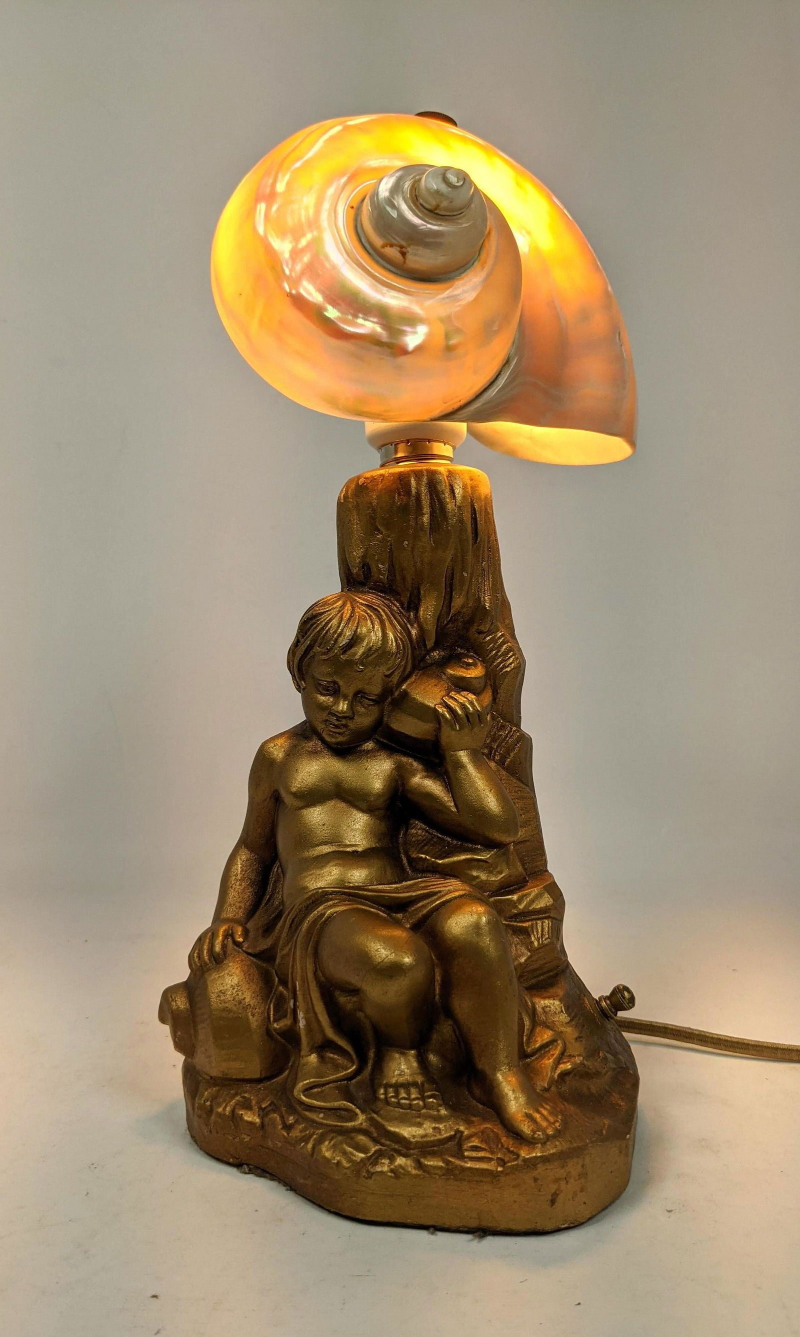 Nautilus Shell Shade Figural Metal Lamp. Young boy hold (1 of 12)