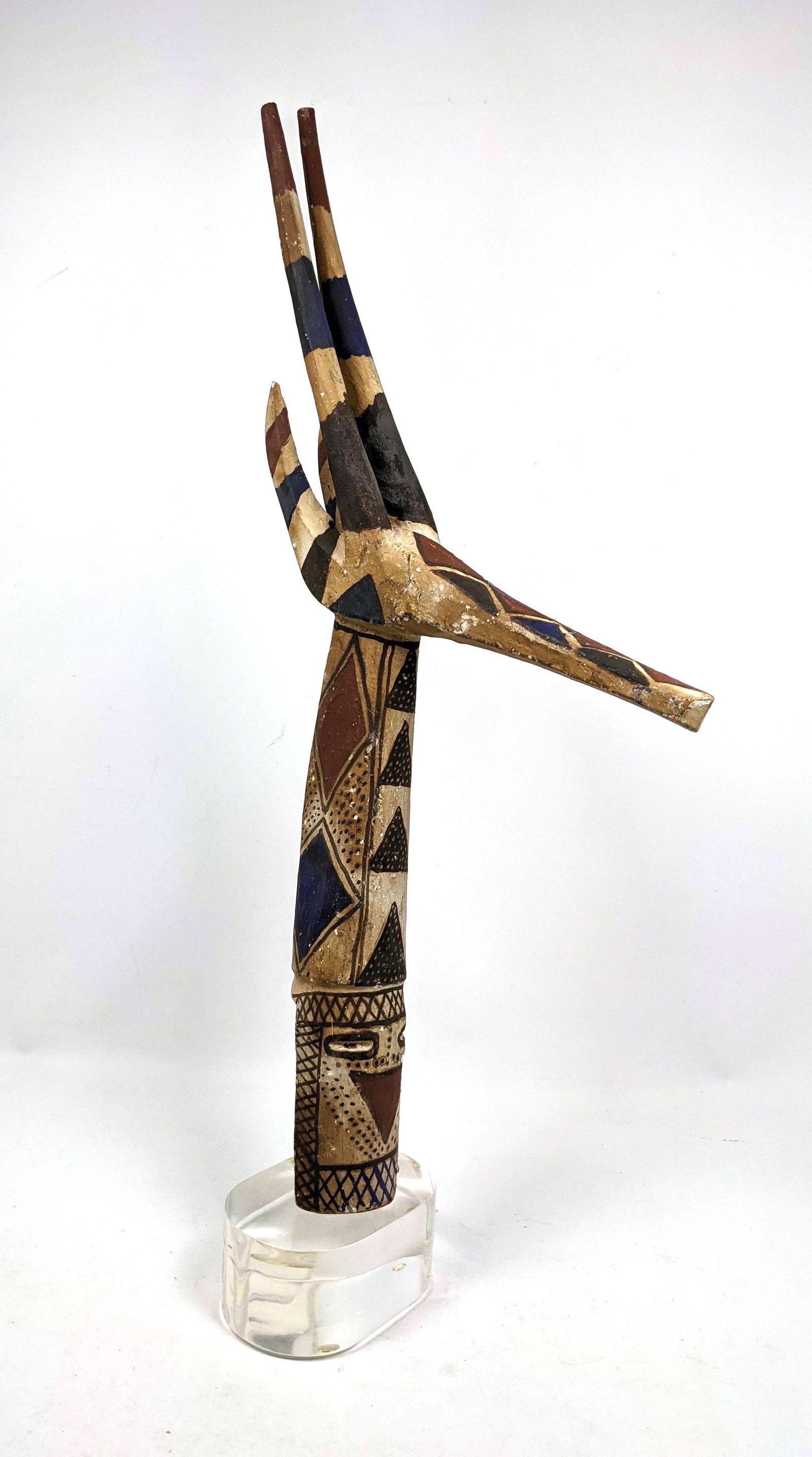 Carved Wood Polychrome Stylized Giraffe Sculpture. Moun: Carved Wood Polychrome Stylized Giraffe Sculpture. Mounted on custom Lucite Base. African.-- Dimensions: H: 30 inches: W: 13 inches: D: 6 inches ---