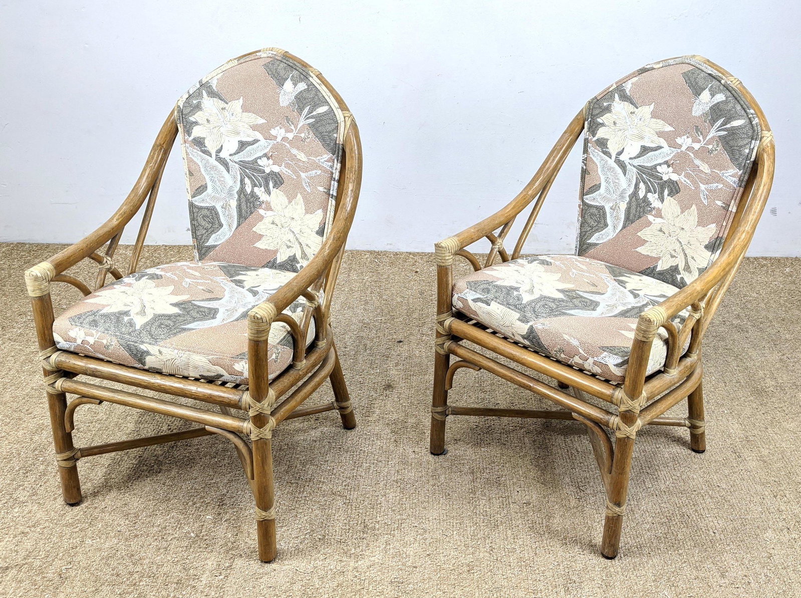Pr McGUIRE Arched Back Rattan Lounge Chairs. Wrapped jo: Pr McGUIRE Arched Back Rattan Lounge Chairs. Wrapped joints and trim. Brass label. -- Dimensions: H: 36 inches: W: 21.5 inches: D: 23 inches ---