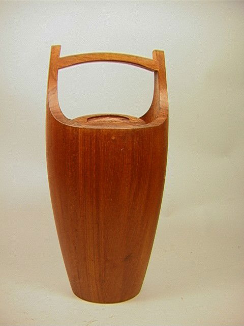 19in Jens Quistgaard Dansk Teak Ice Bucket. IHQ: 19in Jens Quistgaard Dansk Teak Ice Bucket. IHQ Denmark. Red liner.-- Dimensions: H: 19 inches: W: 9 inches: D: 9 inches --- Condition (General): A few knicks, and stains. Please contact us with speci