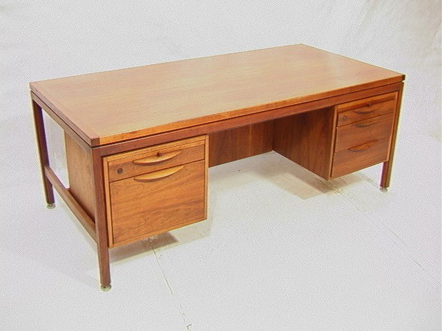 Jens Risom Solid Walnut Executive Desk. Wood pul: Jens Risom Solid Walnut Executive Desk. Wood pulls.-- Dimensions: H: 28.5 inches: W: 74.5 inches: D: 36 inches --- Condition (General): Some light wear and stains. Please contact us with specific ques