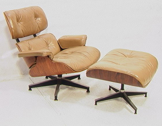 Charles Eames Herman Miller Rosewood Lounge Chair: Charles Eames Herman Miller Rosewood Lounge Chair and Ottoman. 670 -- Dimensions: H: 31.5 inches: W: 33 inches: D: 31 inches --- Condition (General): Professional repair under arms. Wear to leather. P