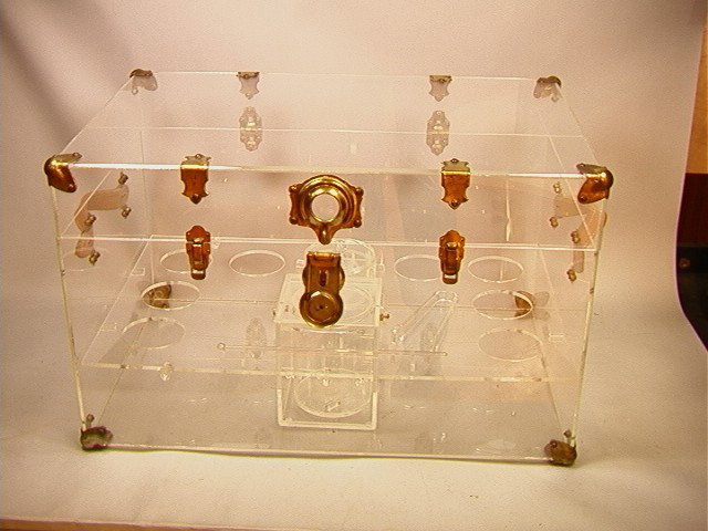 70's Modern Lucite Trunk Bar. Unmarked.: 70's Modern Lucite Trunk Bar. Unmarked.-- Dimensions: H: 17 inches: W: 28.5 inches: D: 19 inches --- Condition (General): Some tarnish to brass and crackling to interior busket. Please contact us with