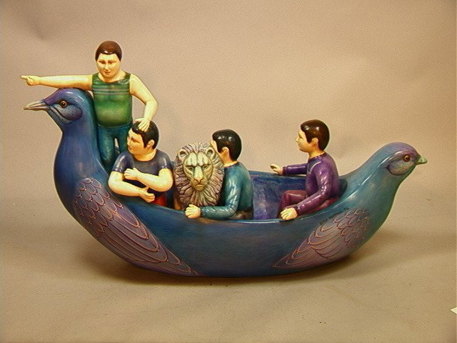 Sergio Bustamante 28/500 Sculpture of Men and lio: Sergio Bustamante 28/500 Sculpture of Men and lion in boat. Signed and numbered.-- Dimensions: H: 17 inches: W: 31 inches: D: 10 inches --- Condition (General): Finger of one man repaired. Please cont