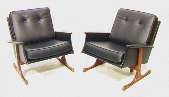 Pair Danish Modern Selig Lounge Chairs. Black Vi: Pair Danish Modern Selig Lounge Chairs. Black Vinyl on unique wood base. Metal tag.-- Dimensions: H: 31 inches: W: 34 inches: D: 35 inches --- Condition (General): Small rip to vinyl. Some stains to b