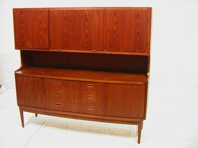 Danish Modern Teak China Credenza Cabinet. Tambou: Danish Modern Teak China Credenza Cabinet. Tambour Doors. 3 Door upper section. 3 Drawer. Two tambour doors lower section. Tyverisikret. Pindex.-- Dimensions: H: 59.5 inches: D: 20 inches: L: 65 inche