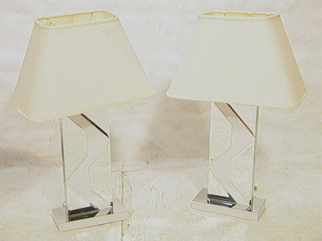 Pr PIERRE CARDIN style Table Lamps. Mirrored geom: Pr PIERRE CARDIN style Table Lamps. Mirrored geometric design on white laminate lamps. Unmarked.-- Dimensions: H: 34 inches --- Condition (General): Some scratches to chrome finish on base. Please con