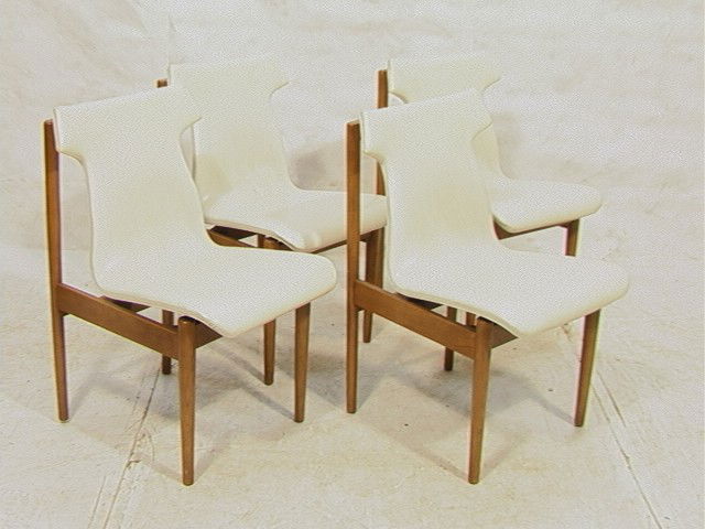 Set Four (4) American Modern Dining Chair. White: Set Four (4) American Modern Dining Chair. White Vinyl Upholstery on floating seat. Nice silhouette from back. 4 PCS. -- Dimensions: H: 31.5 inches: W: 19 inches: D: 22.5 inches --- Condition (General