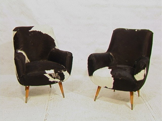 Pr Animal Skin Covered Lounge Chairs. Tapered Leg: Pr Animal Skin Covered Lounge Chairs. Tapered Legs with Brass Caps. 2 PCS.-- Dimensions: H: 33 inches: W: 30 inches: D: 29 inches --- Condition (General): Wear to seat and arm near seam. Some losses t