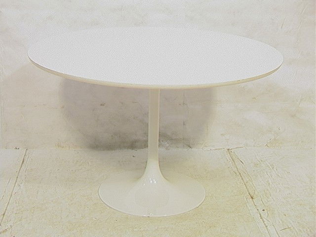 EERO SAARINEN Round Tulip Dining Table. White For: EERO SAARINEN Round Tulip Dining Table. White Formica Top on White Base. -- Dimensions: H: 29 inches: W: 48 inches: D: 48 inches --- Condition (General): Very Good Condition. Few scratches to top. Ple