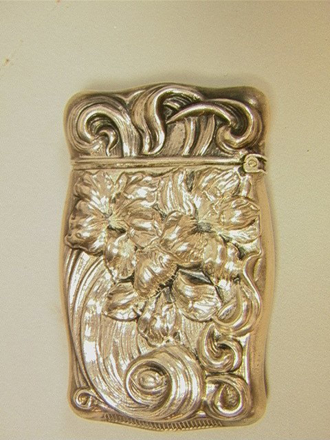 Lilly Art Nouveau Sterling Match Safe. Deep desi: Lilly Art Nouveau Sterling Match Safe. Deep design. -- Dimensions: H: 2.5 inches: W: 1.5 inches: D: 0.4 inches --- Condition (General): Small dent to corner Please contact us with specific questions a