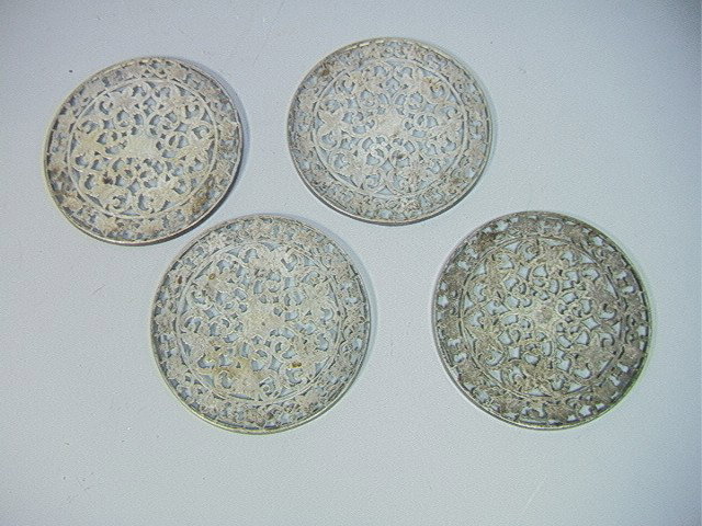 6 pcs Sterling and Crystal. 4 Sterling framed 6": 6 pcs Sterling and Crystal. 4 Sterling framed 6" trivets, and two 800 silver swan salts with movable wings.-- Dimensions: H: 3 inches --- Condition (General): Trivets have some bends. All tarnished. P