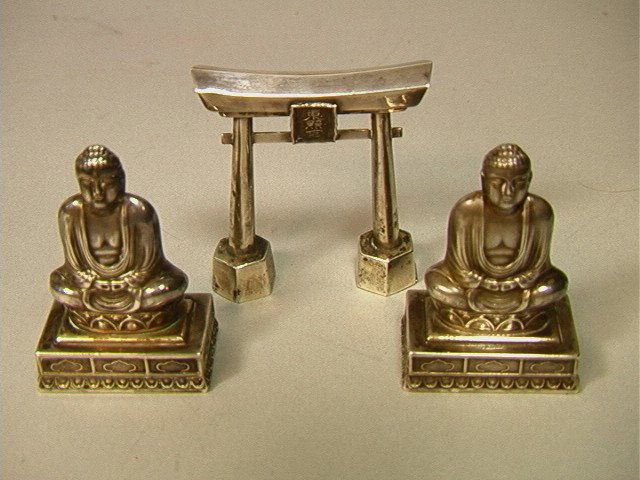 3 pcs Sterling Silver Asian Motif Salt Pepper Sha: 3 pcs Sterling Silver Asian Motif Salt Pepper Shakers. One pair BUDDHA Sterling Shakers marked Silver 970. One single Asian Arch Shaker, marked Sterling. 3 PCS.-- Dimensions: H: 2.5 inches: W: 2.5 inc