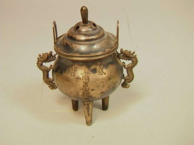 Silver Footed Incense Burner. Asian. Dragon Han: Silver Footed Incense Burner. Asian. Dragon Handles. Marked.-- Dimensions: H: 3.5 inches: W: 3.25 inches: D: 2.25 inches--- Weight: 2.48 Troy ozs. ---- --- Condition (General): One leg shows some sepa