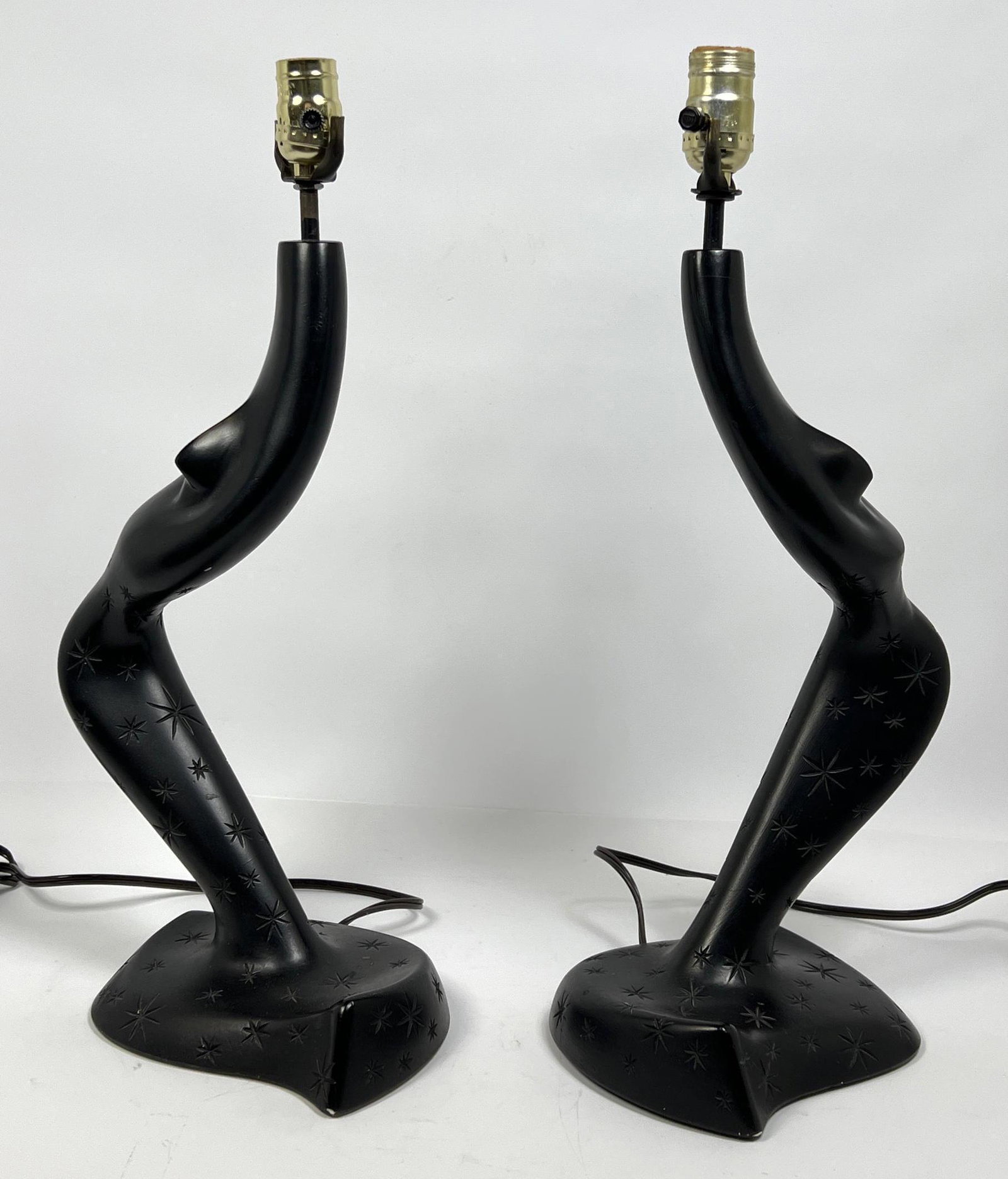 Pair of black plaster sculptureline Leo middleman lamps: Pair of black plaster sculptureline Leo middleman lamps Dimensions: H: 21 inches: W: 8 inches: D: 7 inches ---