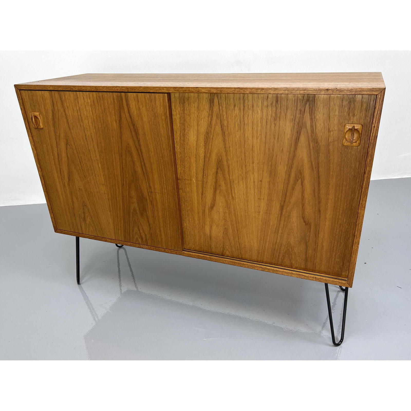 Danish Modern Teak Sliding Door Cabinet Credenza. Newer: Danish Modern Teak Sliding Door Cabinet Credenza. Newer Iron Hairpin Legs. Dimensions: H: 35.5 inches: W: 47.5 inches: D: 16 inches ---